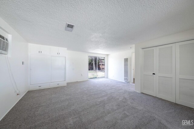 1312 Shattuck Ave, Bakersfield, CA 93305 - unfurnished living room featuring carpet and a textured ceiling