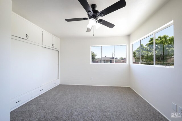 1312 Shattuck Ave, Bakersfield, CA 93305 - spare room with plenty of natural light, carpet flooring, and a ceiling fan
