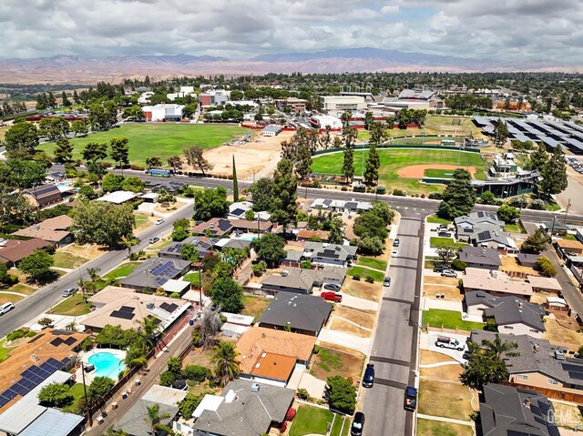 1312 Shattuck Ave, Bakersfield, CA 93305 - aerial overview of property's location with a mountain backdrop and nearby suburban area