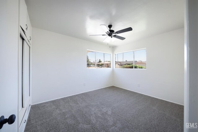 1312 Shattuck Ave, Bakersfield, CA 93305 - unfurnished bedroom with dark colored carpet, a closet, and ceiling fan