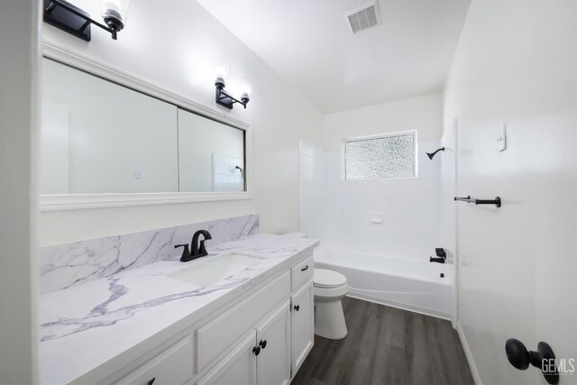 1312 Shattuck Ave, Bakersfield, CA 93305 - full bath featuring vanity, wood finished floors, and shower / bathtub combination