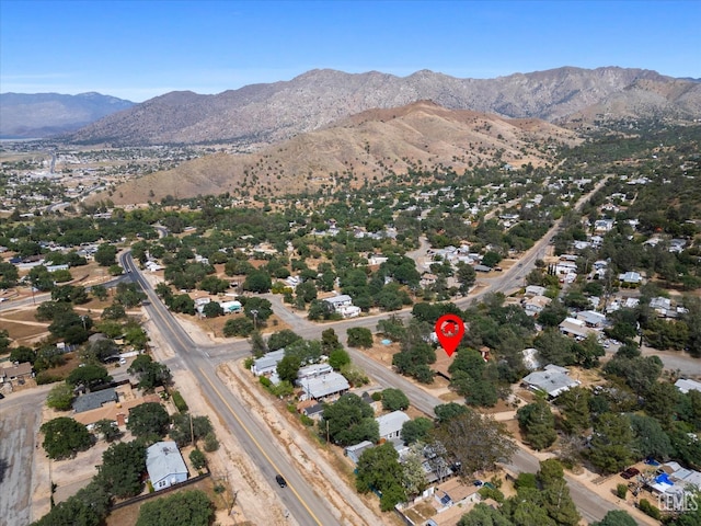 birds eye view of property featuring a mountain view