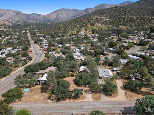 birds eye view of property with a mountain view