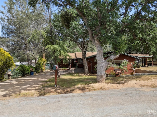 single story home featuring driveway