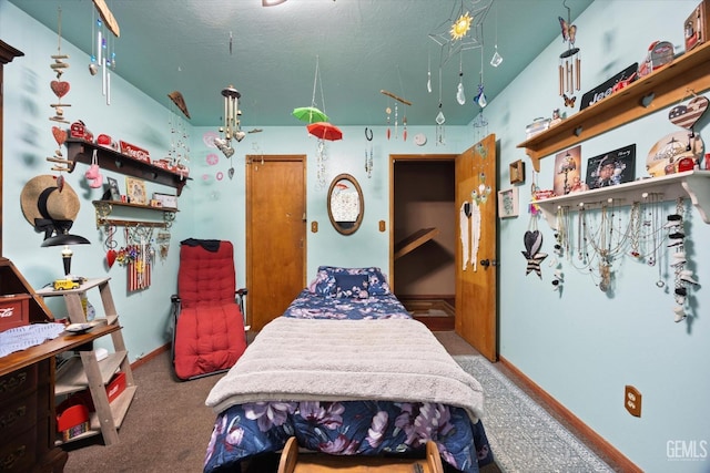 bedroom featuring baseboards and carpet