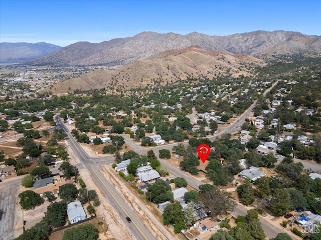 birds eye view of property with a mountain view
