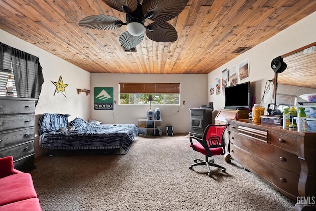 carpeted bedroom with wood ceiling and ceiling fan