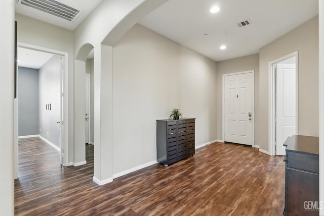 3420 Palagetto Pl, Bakersfield, CA 93314 - corridor with arched walkways, dark wood-style floors, baseboards, and recessed lighting