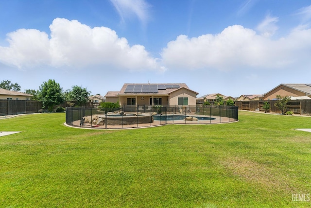 3420 Palagetto Pl, Bakersfield, CA 93314 - rear view of house with roof mounted solar panels, stucco siding, and a patio area