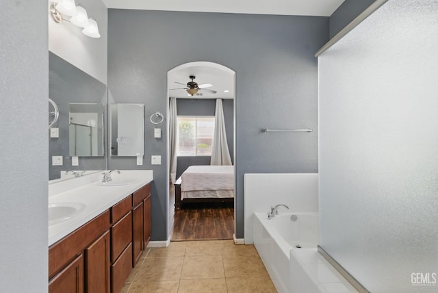 3420 Palagetto Pl, Bakersfield, CA 93314 - full bath featuring a ceiling fan, tile patterned floors, double vanity, a bath, and ensuite bath
