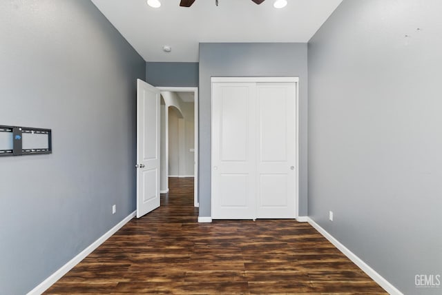 3420 Palagetto Pl, Bakersfield, CA 93314 - unfurnished bedroom with arched walkways, dark wood-type flooring, baseboards, a closet, and recessed lighting