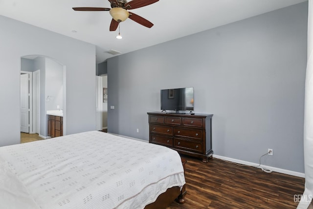 3420 Palagetto Pl, Bakersfield, CA 93314 - bedroom with arched walkways, baseboards, dark wood finished floors, and a ceiling fan