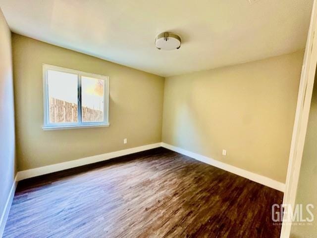 2004 Magdelena Ave, Bakersfield, CA 93307 - spare room with dark wood-type flooring and baseboards