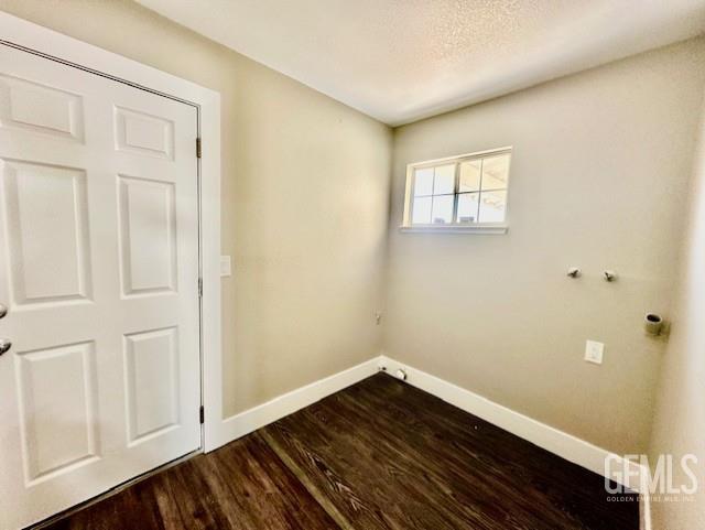 2004 Magdelena Ave, Bakersfield, CA 93307 - unfurnished room with baseboards and dark wood finished floors