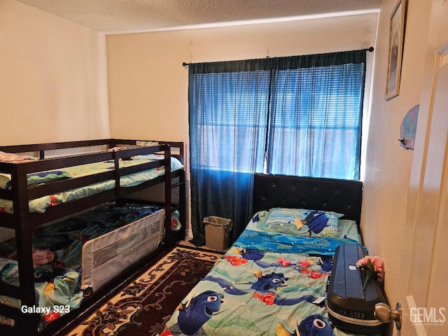 bedroom featuring a textured ceiling