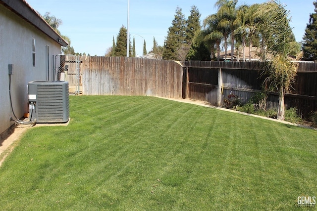 view of yard featuring cooling unit and a fenced backyard