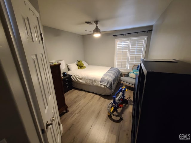 bedroom featuring ceiling fan, light wood-type flooring, and visible vents