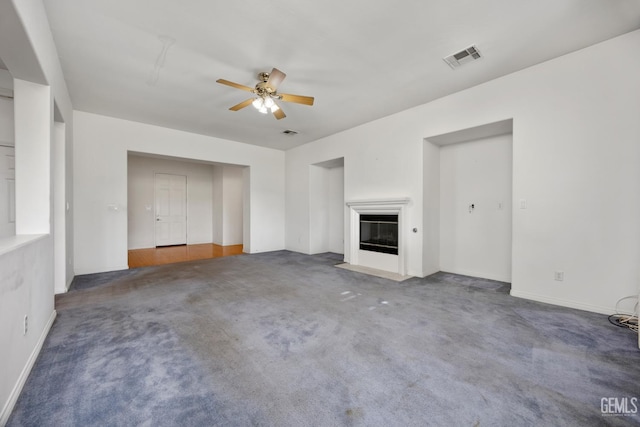 4702 Aviara Dr, Bakersfield, CA 93312 - unfurnished living room with a ceiling fan, carpet, a fireplace with flush hearth, and baseboards