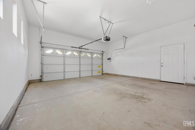 4702 Aviara Dr, Bakersfield, CA 93312 - garage featuring a garage door opener and baseboards