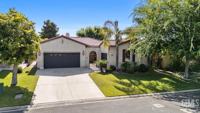 4702 Aviara Dr, Bakersfield, CA 93312 - mediterranean / spanish-style home featuring driveway, a garage, a tile roof, stucco siding, and a front lawn