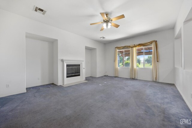 4702 Aviara Dr, Bakersfield, CA 93312 - unfurnished living room with ceiling fan, carpet floors, and a fireplace with flush hearth