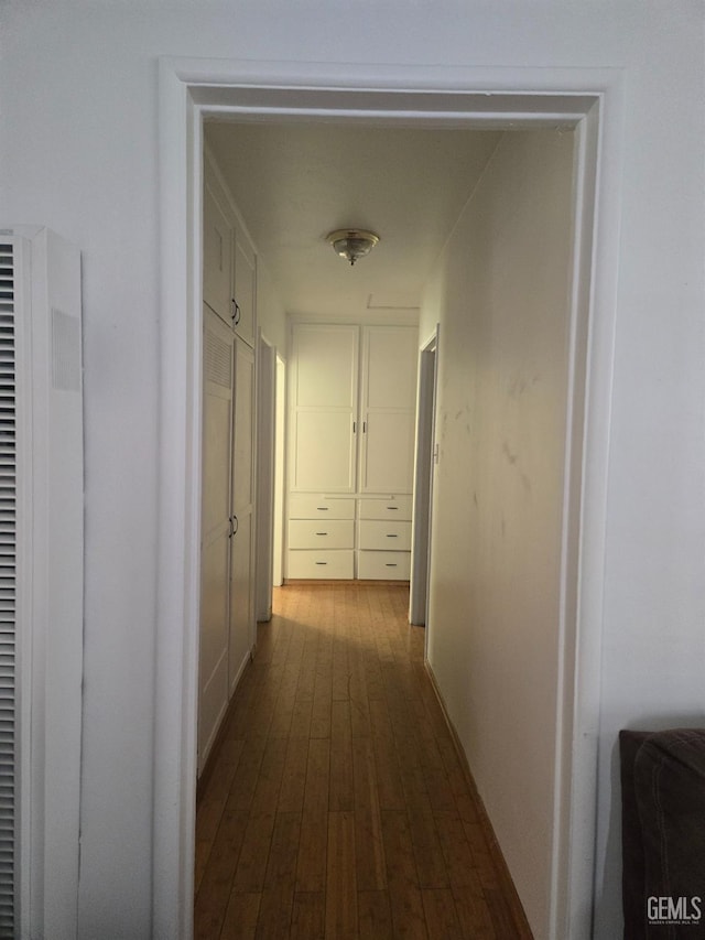 hallway featuring wood-type flooring