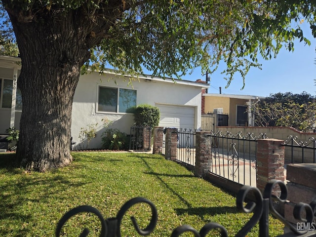 view of front facade with a front lawn and a garage