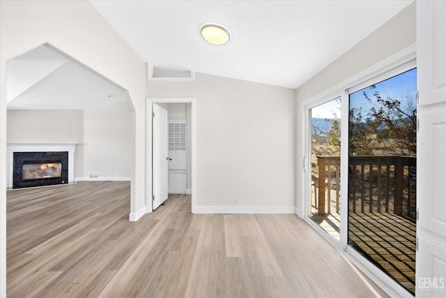4500 Joshua Dr, Mountain Mesa, CA 93240 - unfurnished living room featuring vaulted ceiling, light wood-type flooring, and a premium fireplace