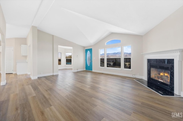 4500 Joshua Dr, Mountain Mesa, CA 93240 - unfurnished living room with a fireplace, wood finished floors, and lofted ceiling