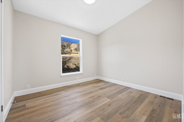4500 Joshua Dr, Mountain Mesa, CA 93240 - unfurnished room featuring wood finished floors and lofted ceiling
