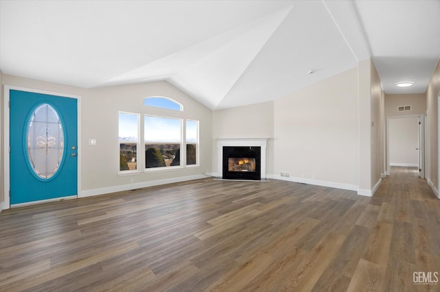 4500 Joshua Dr, Mountain Mesa, CA 93240 - unfurnished living room with wood finished floors, vaulted ceiling, and a glass covered fireplace