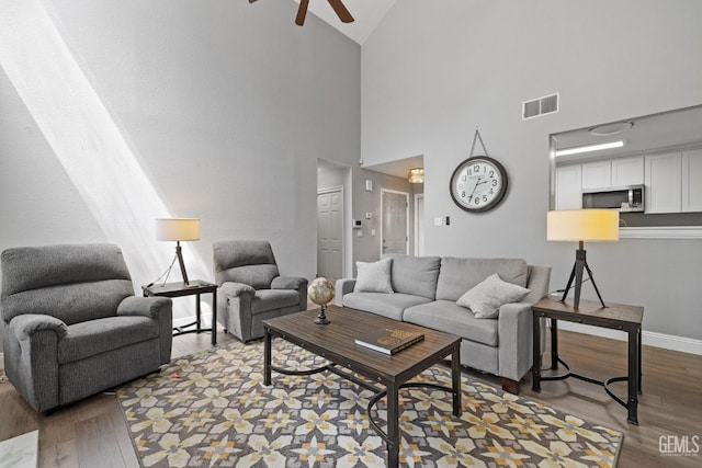 8000 Kroll Way Unit 29, Bakersfield, CA 93311 - living room with high vaulted ceiling, ceiling fan, wood finished floors, and baseboards