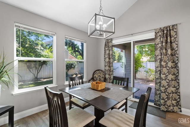 8000 Kroll Way Unit 29, Bakersfield, CA 93311 - dining room with baseboards, wood finished floors, a chandelier, and vaulted ceiling