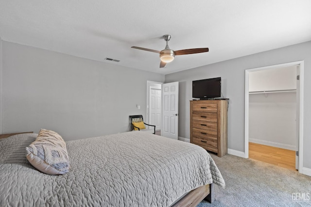 8000 Kroll Way Unit 29, Bakersfield, CA 93311 - bedroom with carpet flooring, a spacious closet, baseboards, a ceiling fan, and a closet