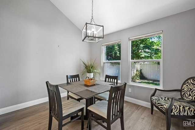 8000 Kroll Way Unit 29, Bakersfield, CA 93311 - dining room with wood finished floors, a chandelier, baseboards, and vaulted ceiling