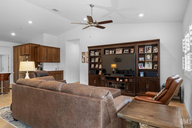 3308 Whispering Brook Ln, Shafter, CA 93263 - living room with visible vents, baseboards, light wood-type flooring, a ceiling fan, and vaulted ceiling