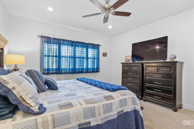 bedroom featuring light colored carpet, recessed lighting, baseboards, and ceiling fan