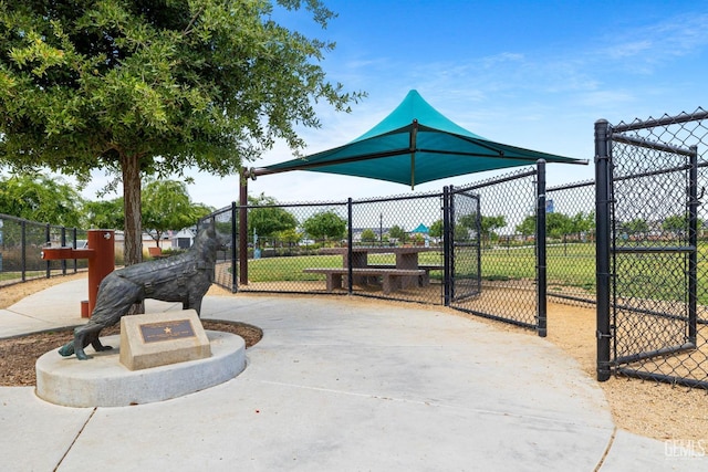surrounding community with fence and a gate