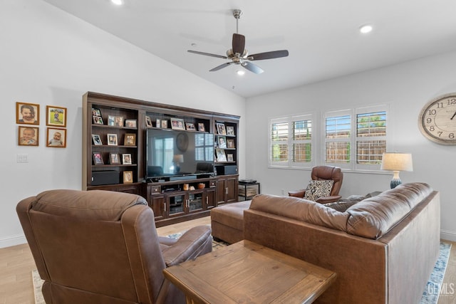 living area with baseboards, a ceiling fan, recessed lighting, and lofted ceiling