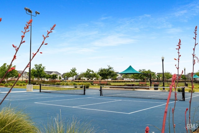 view of sport court featuring fence and community basketball court