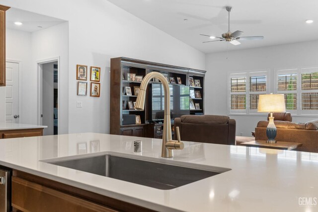 3308 Whispering Brook Ln, Shafter, CA 93263 - kitchen featuring a ceiling fan, a sink, open floor plan, and light countertops