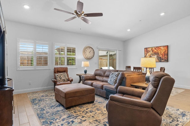 living room featuring baseboards, a ceiling fan, recessed lighting, and wood finished floors