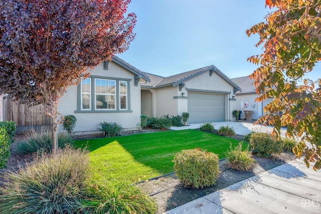 ranch-style home with a garage and a front yard