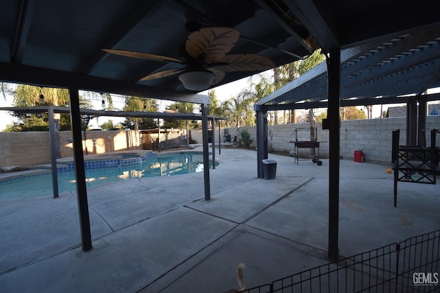 view of pool featuring ceiling fan, a patio, a fenced backyard, and a pergola