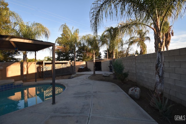 view of swimming pool with a patio, a fenced backyard, and a fenced in pool