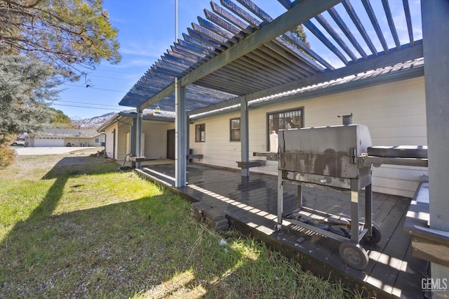 exterior space with a wooden deck and a pergola