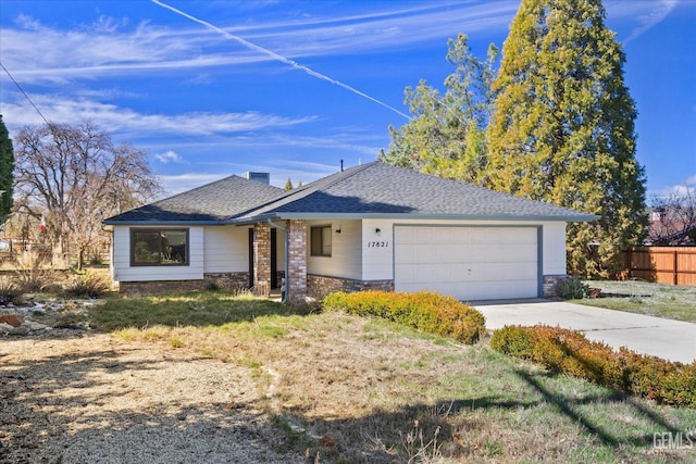 single story home with a garage, driveway, roof with shingles, and fence