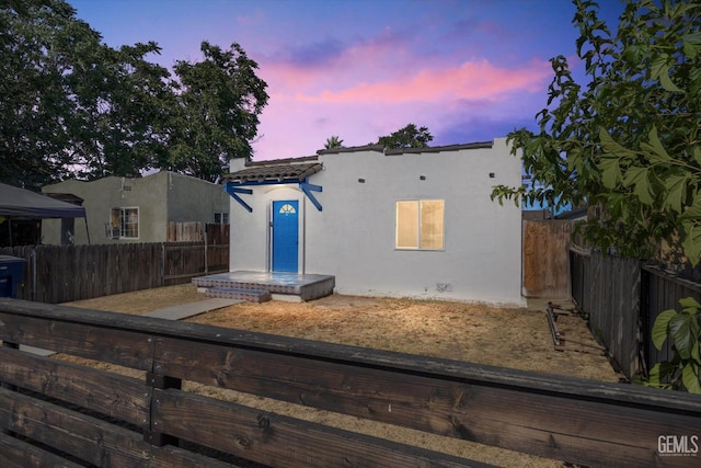 914 P St, Bakersfield, CA 93304 - mediterranean / spanish-style home featuring a fenced backyard and stucco siding