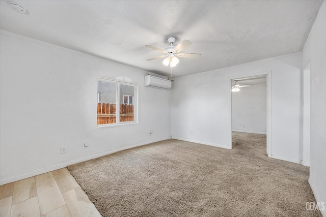 914 P St, Bakersfield, CA 93304 - spare room featuring a wall unit AC, a ceiling fan, and a smoke detector