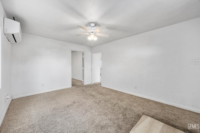 914 P St, Bakersfield, CA 93304 - carpeted empty room featuring a wall mounted AC and a ceiling fan